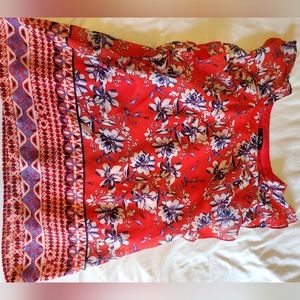 Red top with white and blue flowers, size Small.
